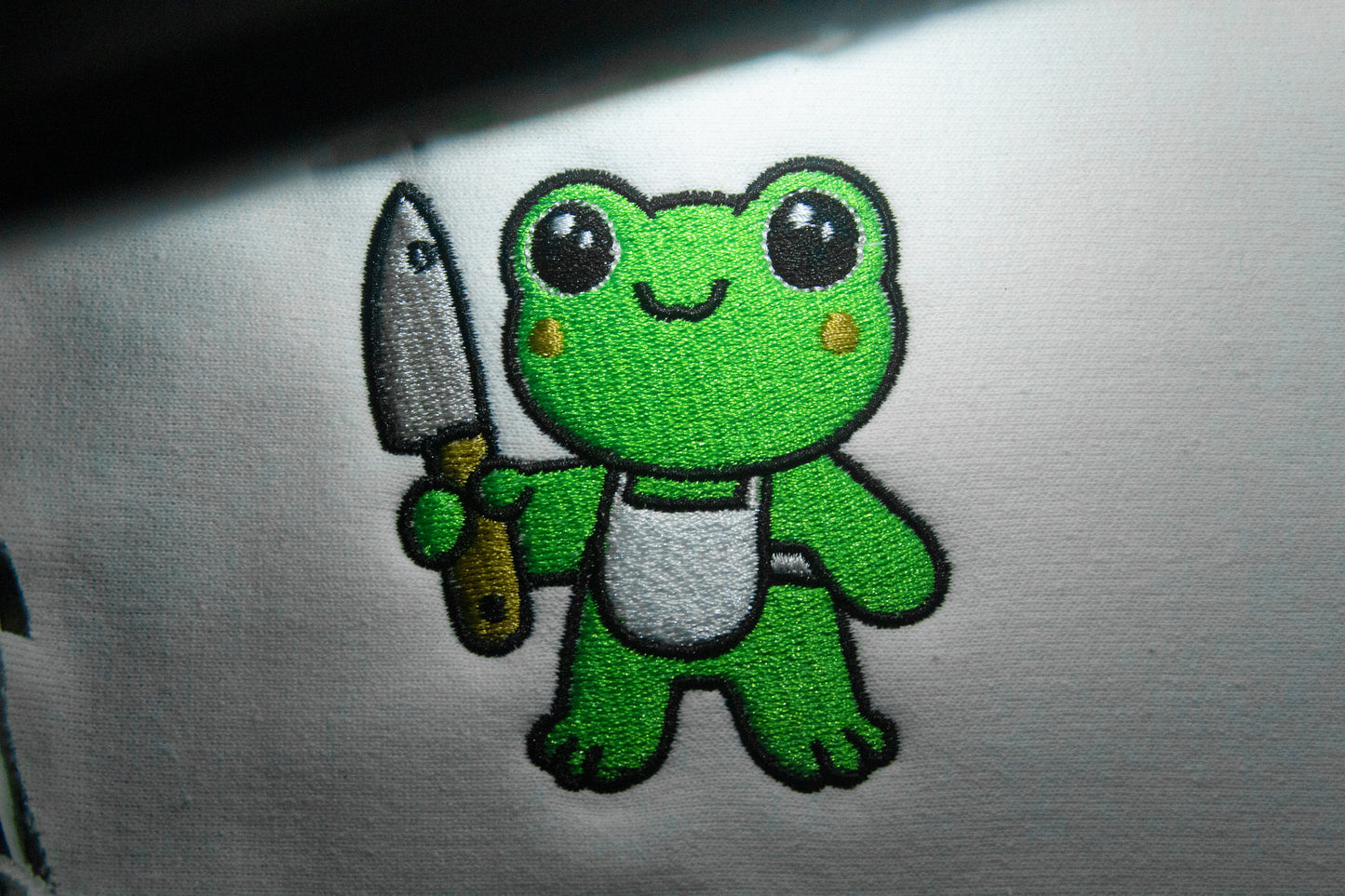 Frog Holding Knife